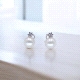 Pendientes de oro blanco con zirconitas con perlas